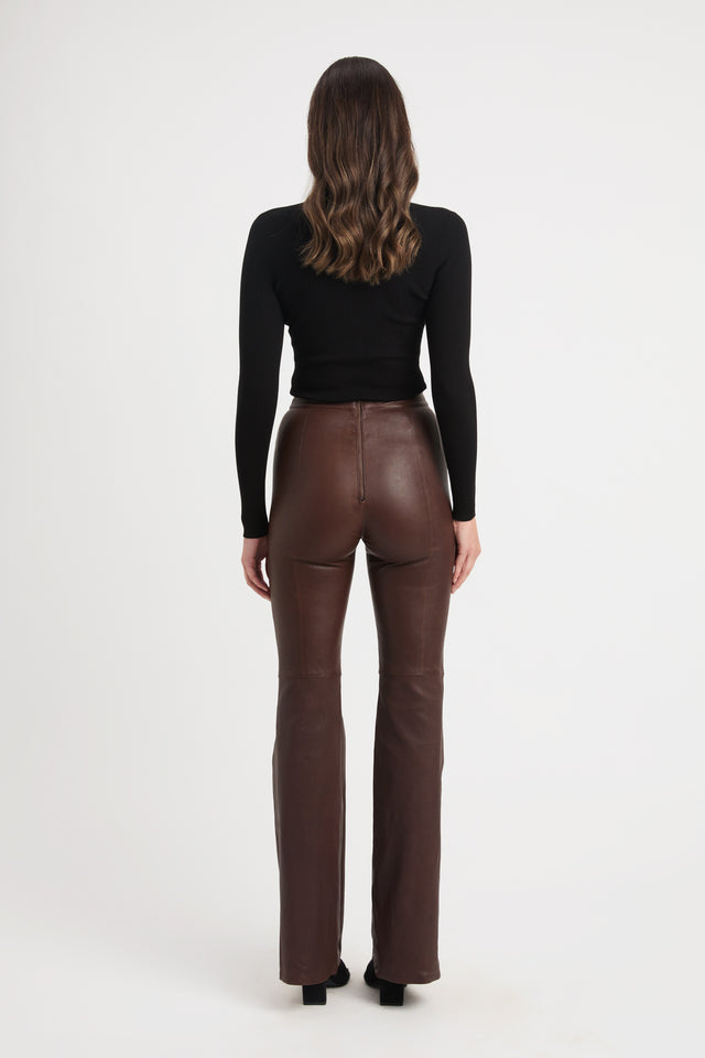 Maroon ribbed leather pants and leather top ensemble